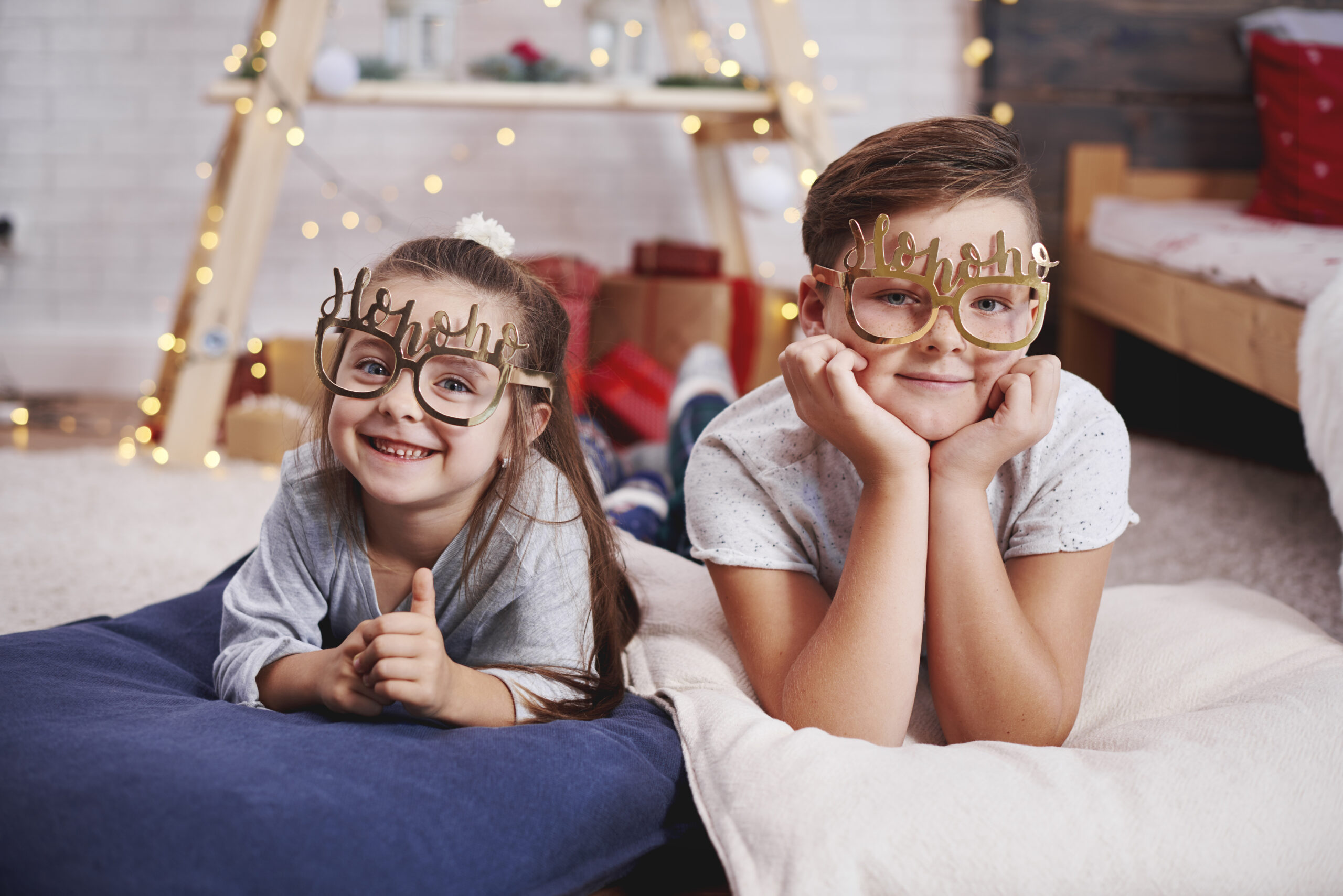 Portrait of happy siblings at Christmas
